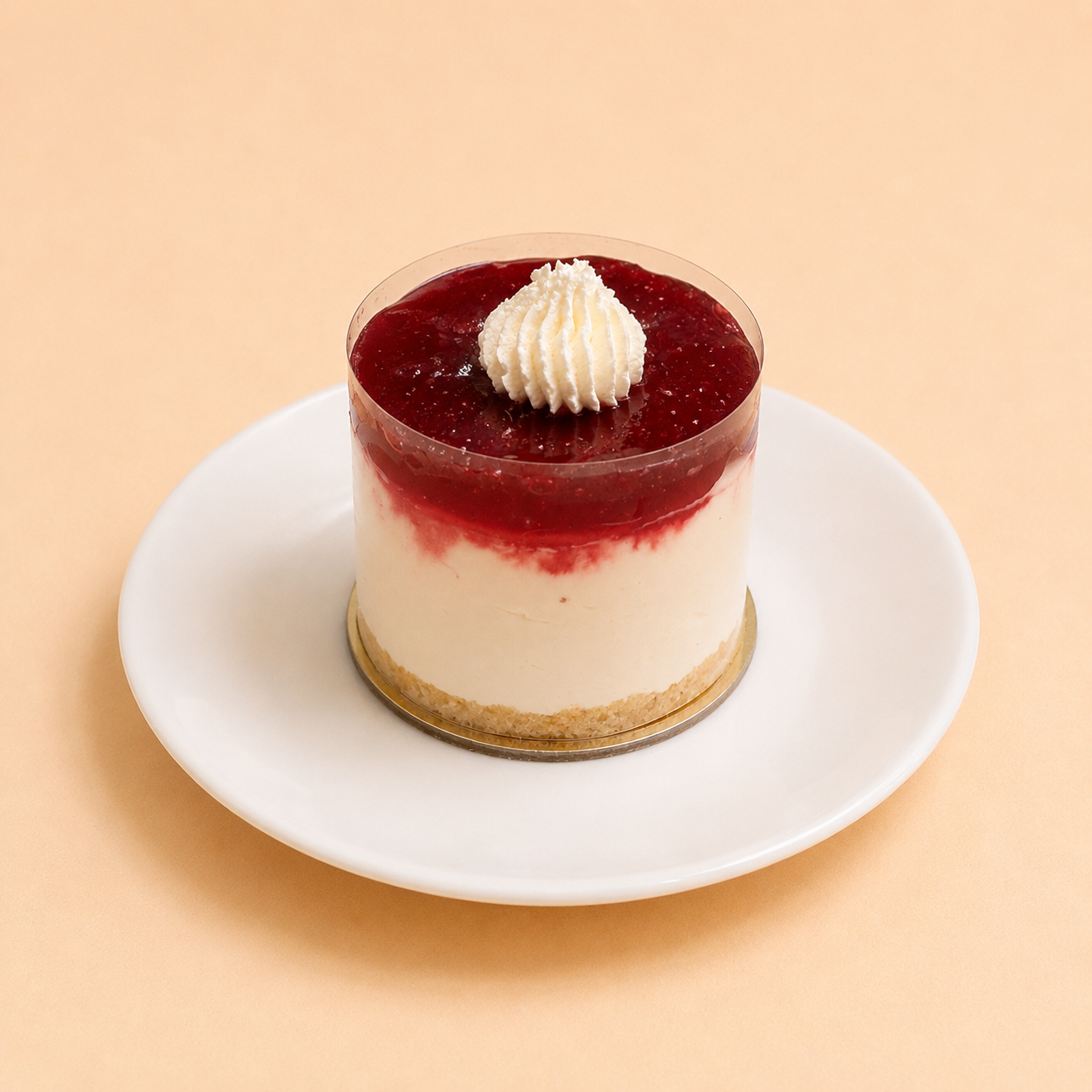 Slice of raspberry cheesecake topped with fresh berries